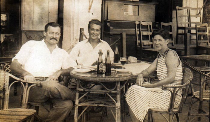 Ernest Hemingway at a Café with Friends
